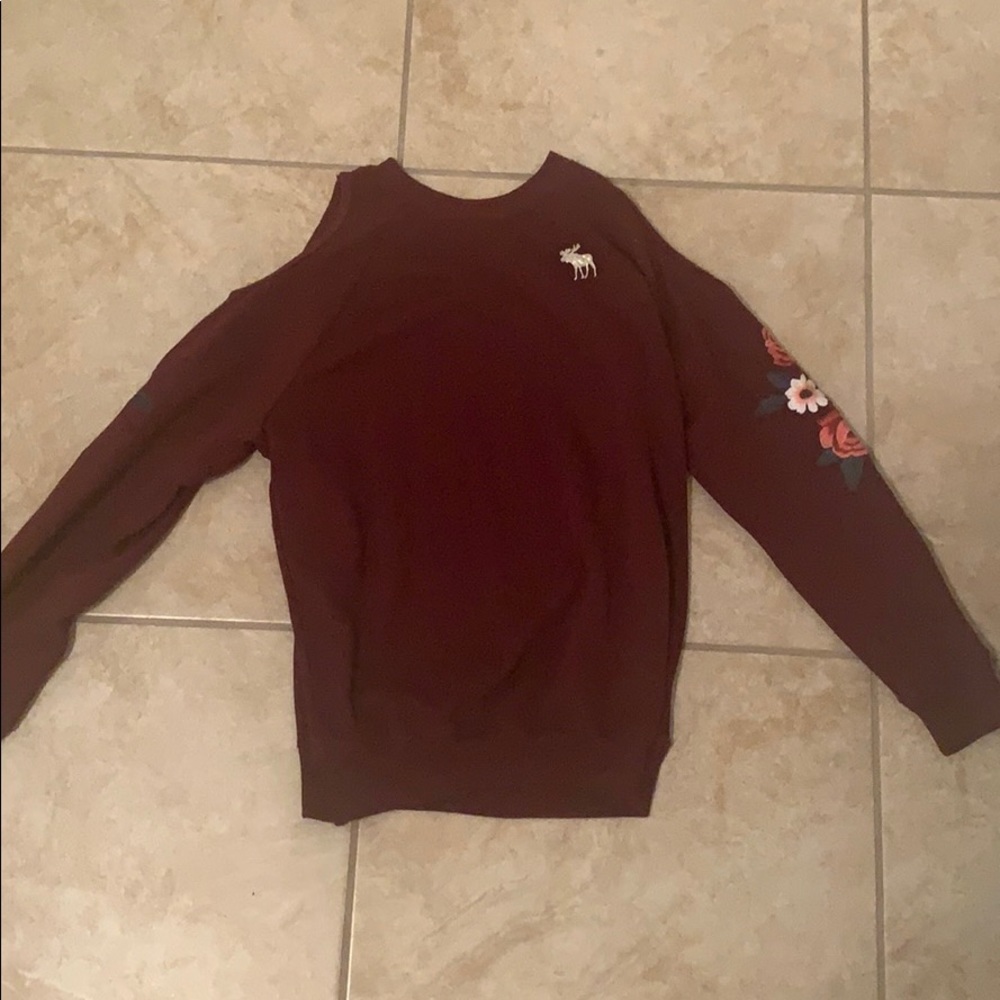 An off the shoulder long sleeve shirt